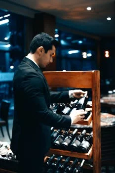 professional sommelier with wine selection